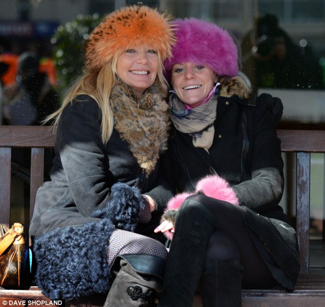 Colour splash: These two race fans went for orange, pink, blue and natural hues to stay warm