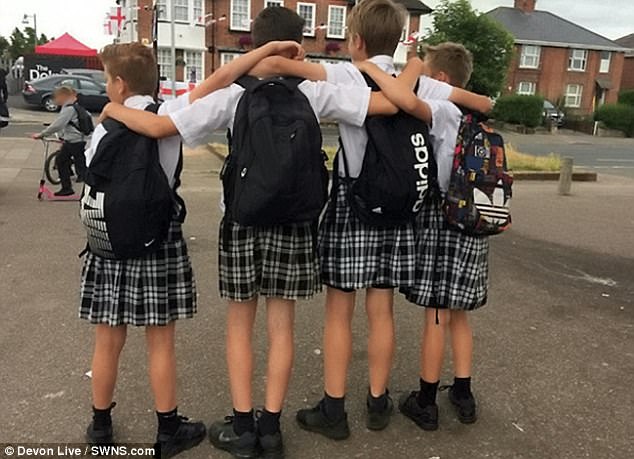 After the teenagers turned up in their skirts (pictured), the school said they were considering changing the policy