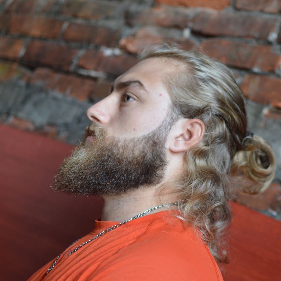 Half man bun and beard